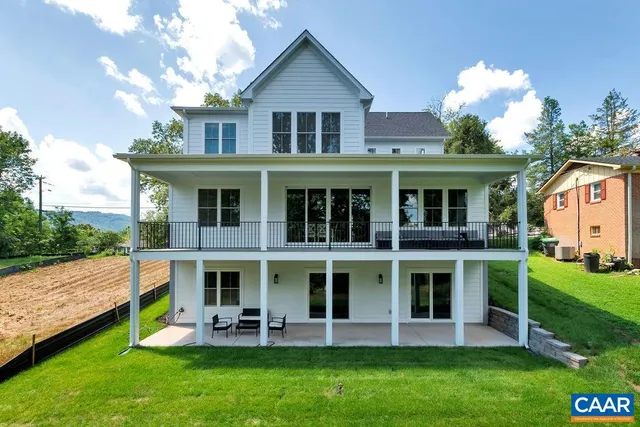 a view of a house with a yard porch and sitting area