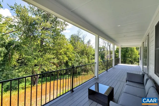 a balcony with wooden floor