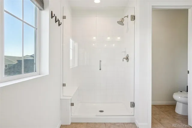 a bedroom with a bed and a table