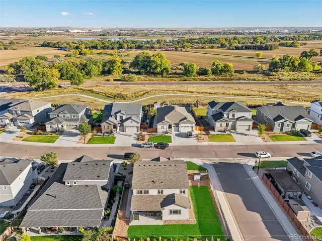 an aerial view of a house with a garden