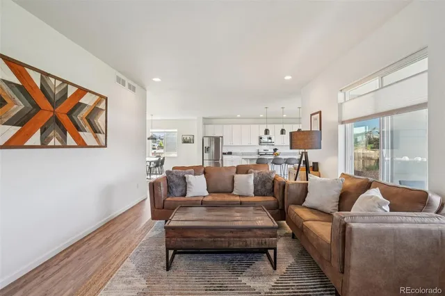 a living room with furniture and a table