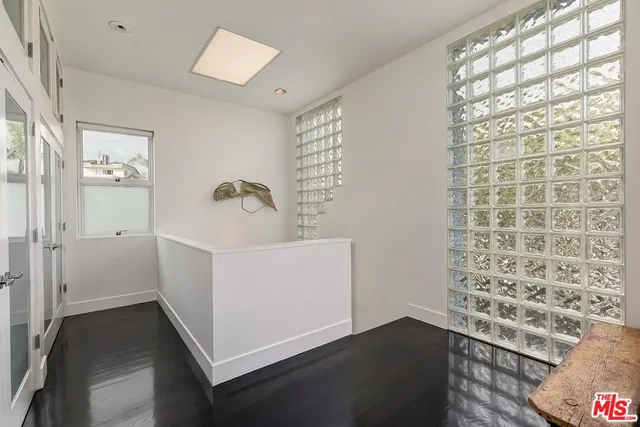 a bedroom with a bed and a view of bathroom