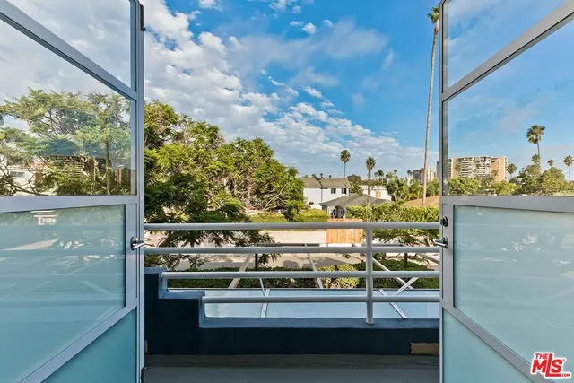 a kitchen with a sink and refrigerator