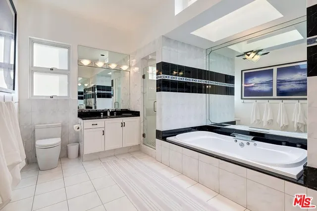 a kitchen with a sink a stove and cabinets