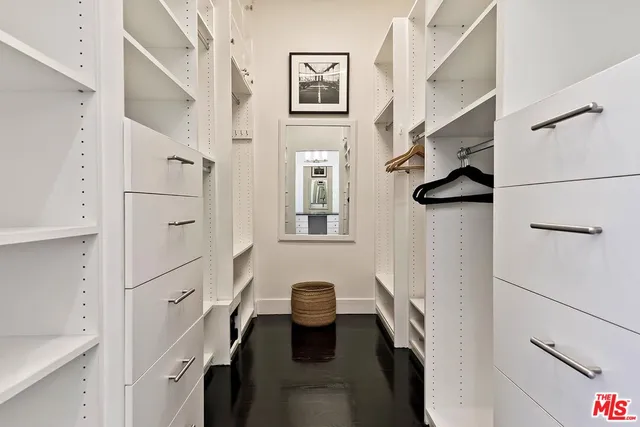 a bedroom with a bed and a table