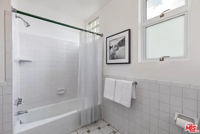 a bedroom with a bed and chair