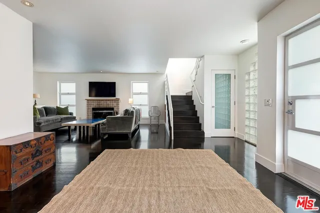 a kitchen with a refrigerator and a stove top oven