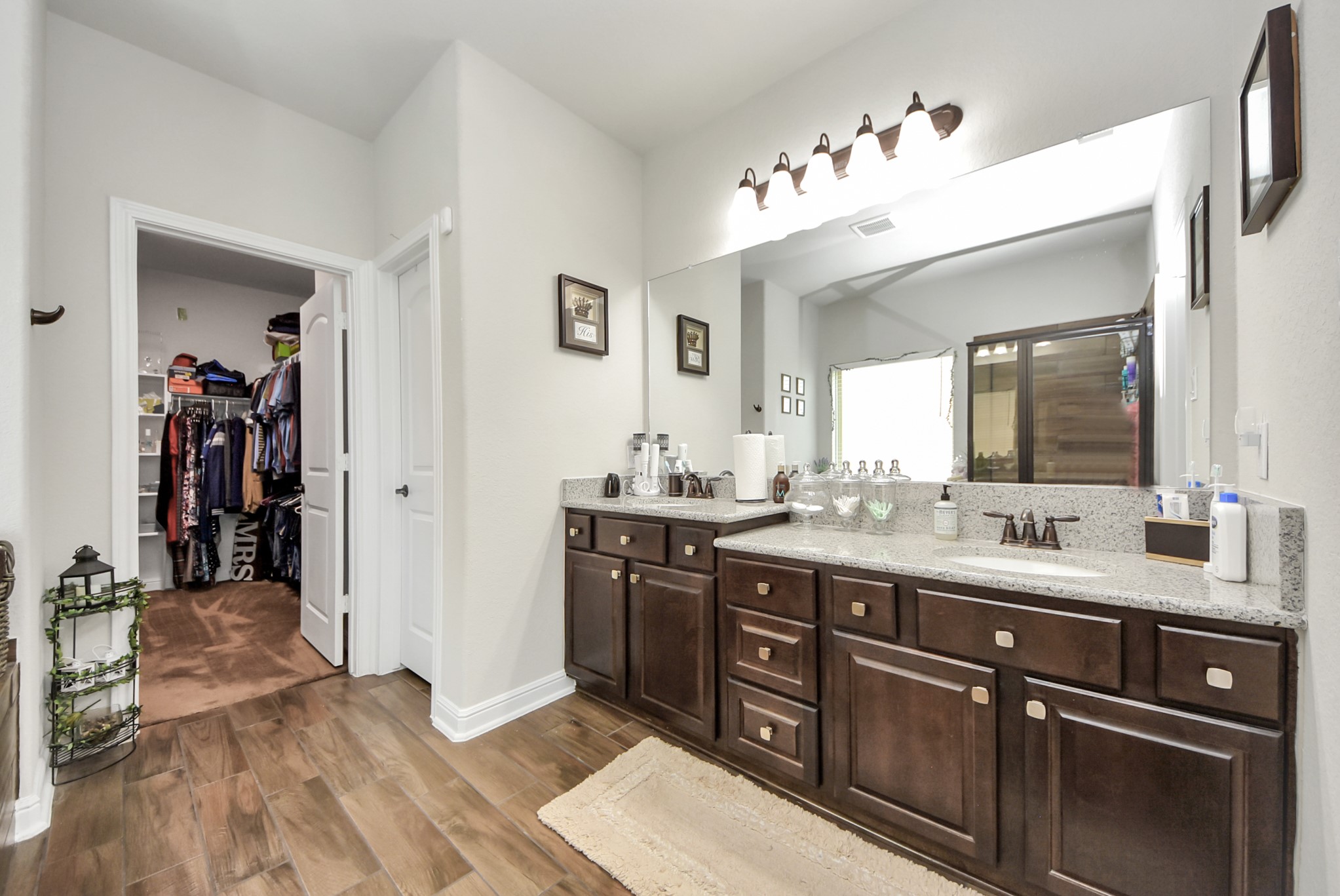 24503 Eucalyptus Way Spring, TX 77373 - Photo 8 of 27 a spacious bathroom with a double vanity sink and a mirror
