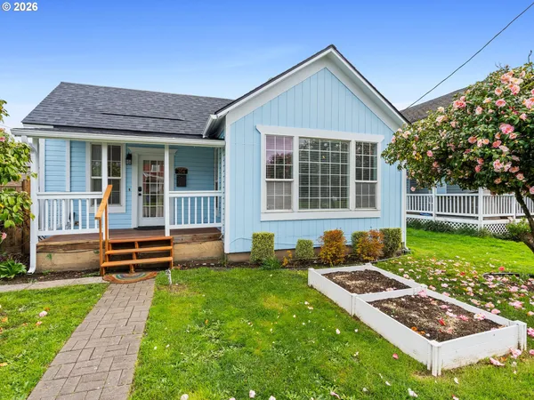 a front view of a house with garden