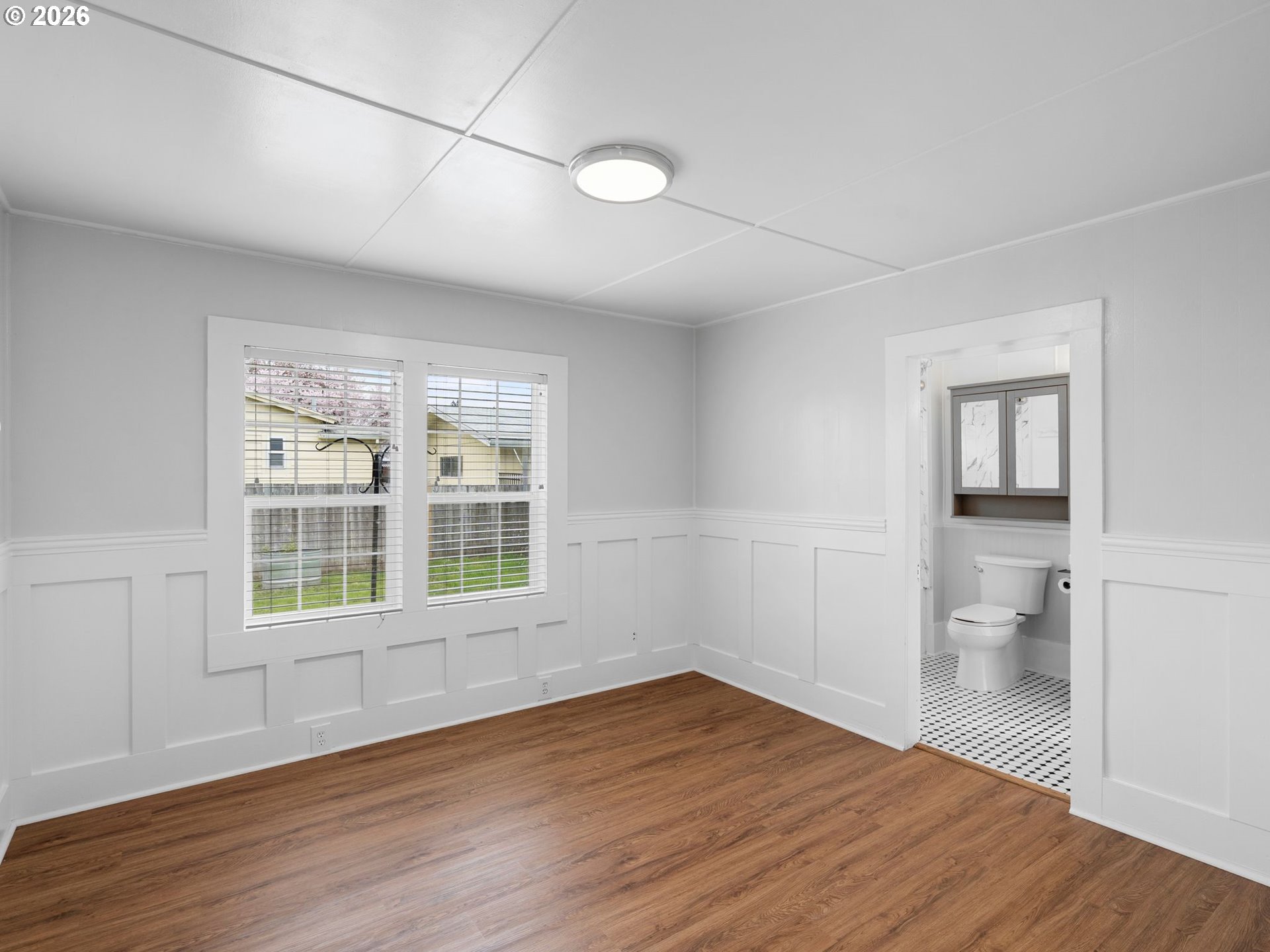 204 South Main Street Newberg, OR 97132 - Photo 13 of 28 a view of a room with wooden floor and a window