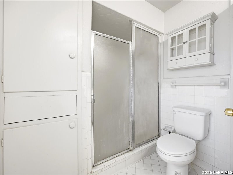 134 Robinhood Kenedy, TX 78119 - Photo 18 of 26 a white toilet sitting next to a bathroom sink