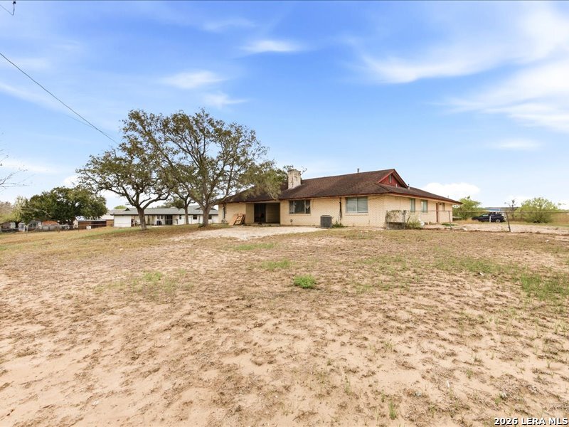 134 Robinhood Kenedy, TX 78119 - Photo 26 of 26 a front view of a house with a yard