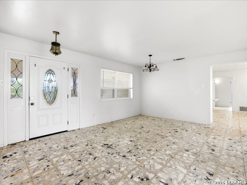 134 Robinhood Kenedy, TX 78119 - Photo 3 of 26 a view of a livingroom with wooden floor and a window
