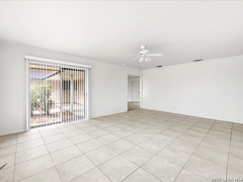 134 Robinhood Kenedy, TX 78119 - Photo 6 of 26 a view of an empty room with a window