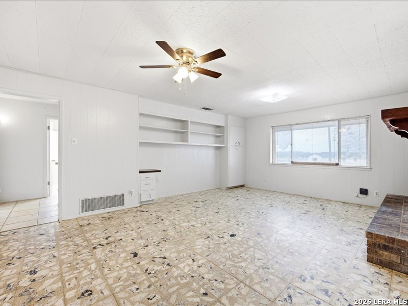 134 Robinhood Kenedy, TX 78119 - Photo 7 of 26 a view of a livingroom with wooden floor and a window