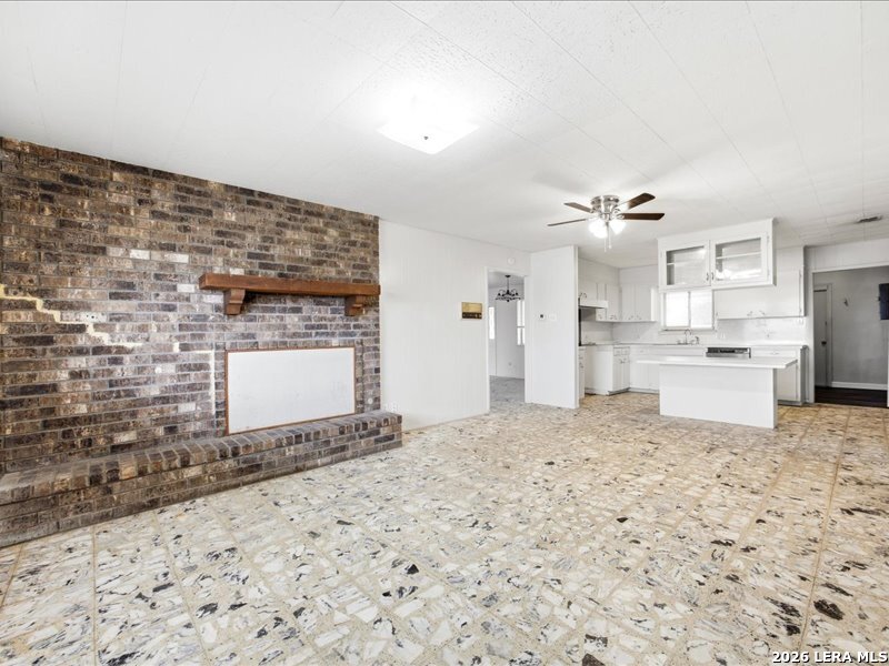 134 Robinhood Kenedy, TX 78119 - Photo 9 of 26 a room with a stove top oven and kitchen view