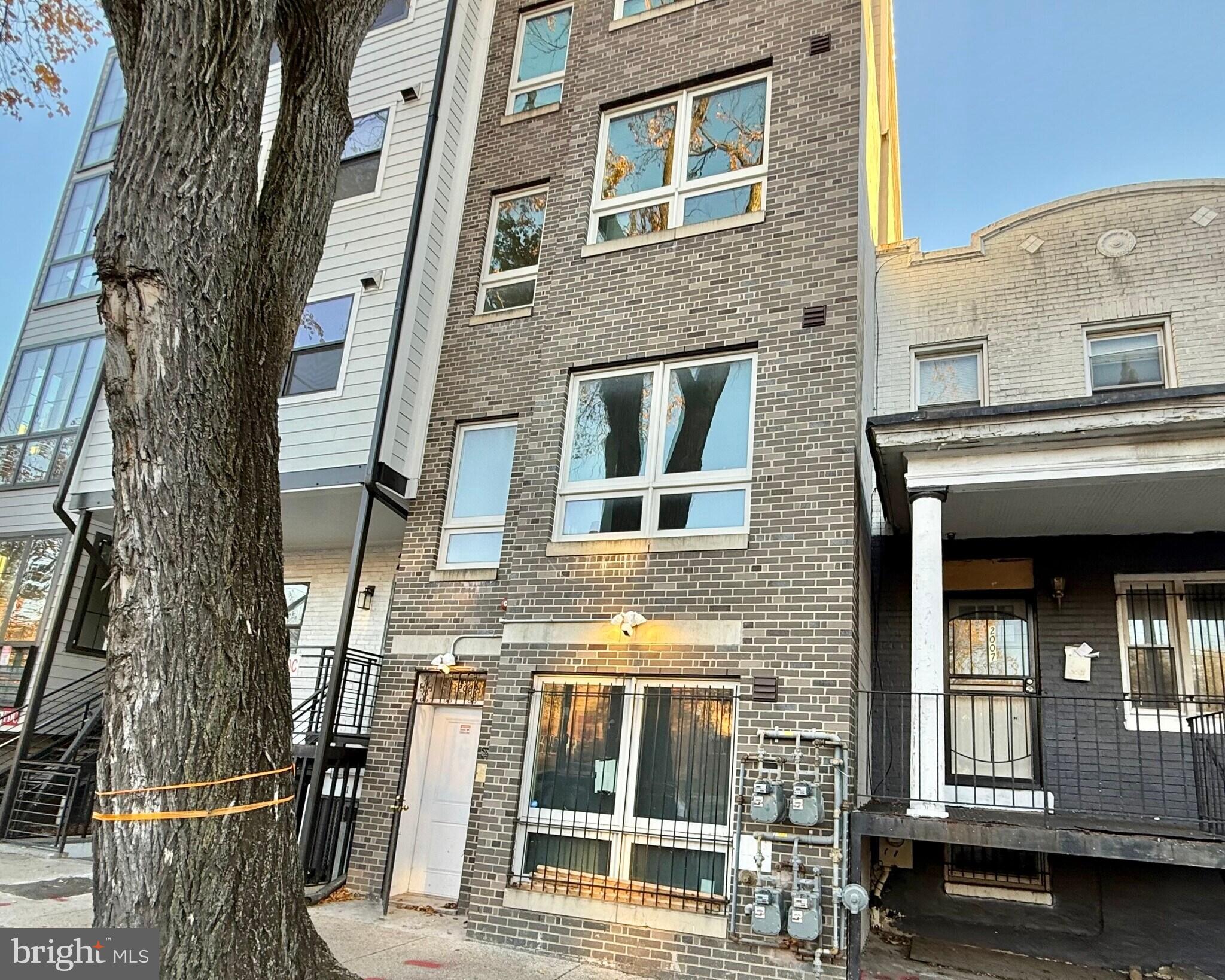 2009 Benning Road Northeast, Unit 1 Washington, DC 20002 - Photo 2 of 11 a front view of a building with a glass door