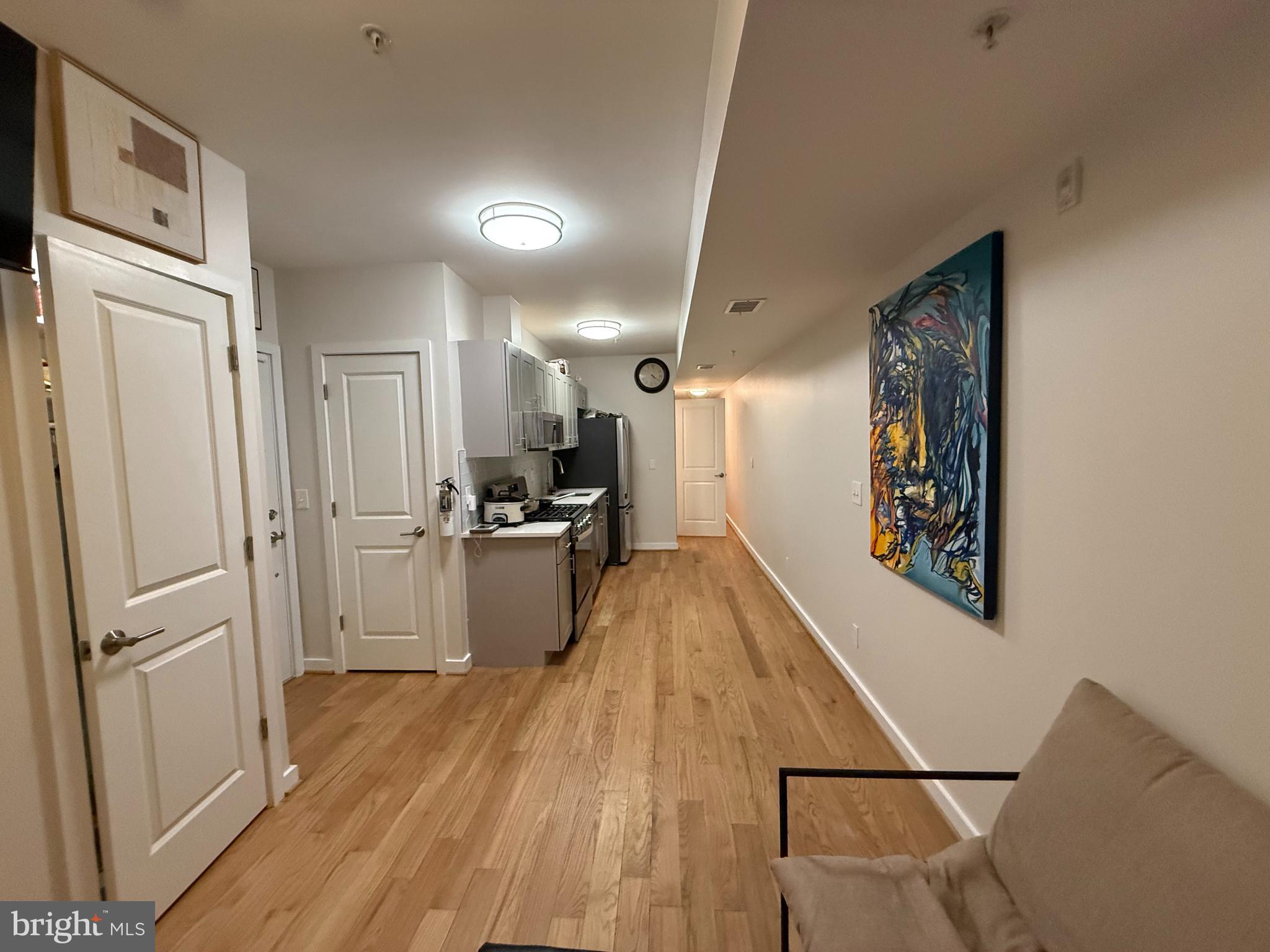2009 Benning Road Northeast, Unit 1 Washington, DC 20002 - Photo 3 of 11 a kitchen with a refrigerator a sink and dishwasher