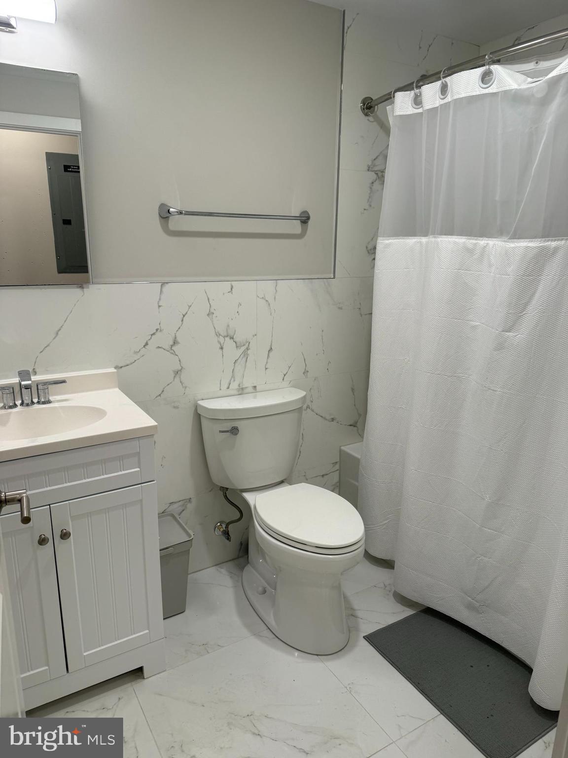 2009 Benning Road Northeast, Unit 1 Washington, DC 20002 - Photo 5 of 11 a bathroom with a sink toilet and shower