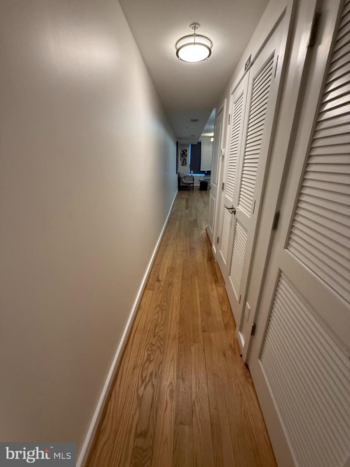 2009 Benning Road Northeast, Unit 1 Washington, DC 20002 - Photo 7 of 11 a view of a hallway with wooden floor