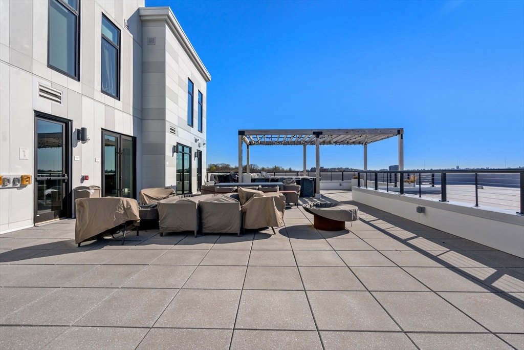 191 Washington Street, Unit 615 Boston, MA 02135 - Photo 17 of 23 a view of a terrace with sitting area