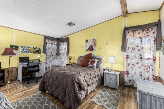 a bedroom with a bed and a couch