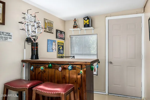 a dining room with a table and chairs