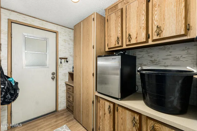 a view of a refrigerator and microwave