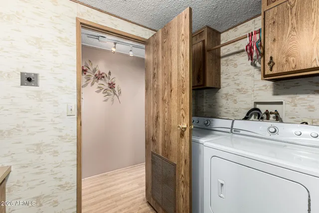a view of a storage & utility room with washer and dryer