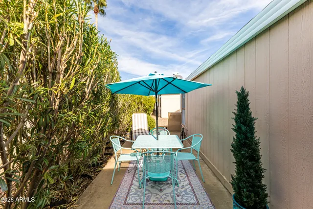 an outdoor space with furniture and umbrella