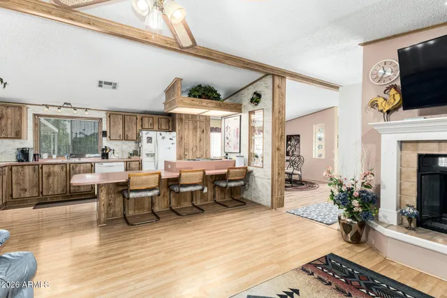 a view of a livingroom with furniture window and wooden floor