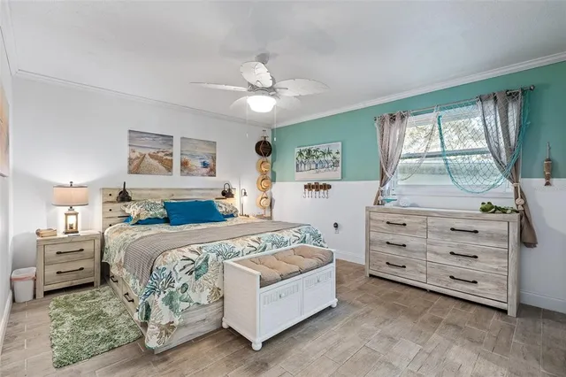 a bedroom with a bed and a dresser