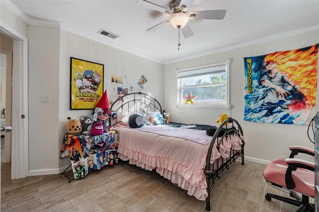 a bed room with a bed and a chair