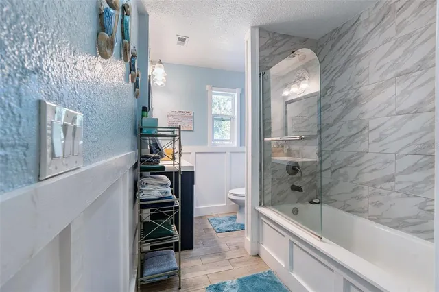 a bathroom with a bathtub and a shower