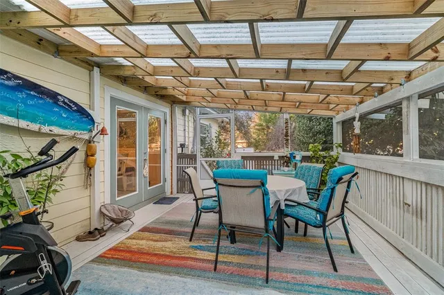 a view of a chairs and table in a patio