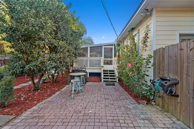 a view of a chairs and table in the patio
