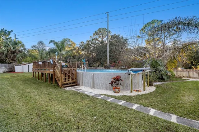 a view of a park with iron fence