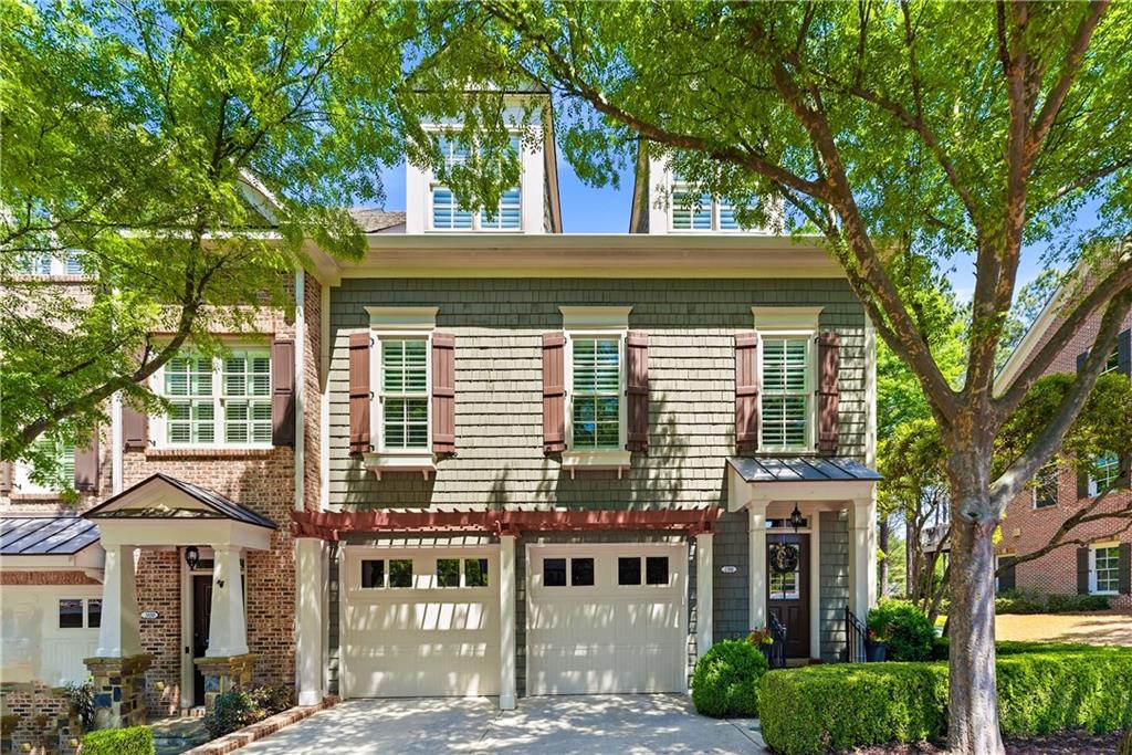 2398 St Davids Square, Unit 16 Kennesaw, GA 30152 - Photo 1 of 48 a view of a white house next to a large tree