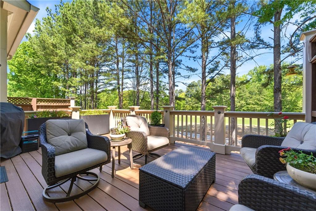 2398 St Davids Square, Unit 16 Kennesaw, GA 30152 - Photo 16 of 48 a roof deck with couches and wooden fence