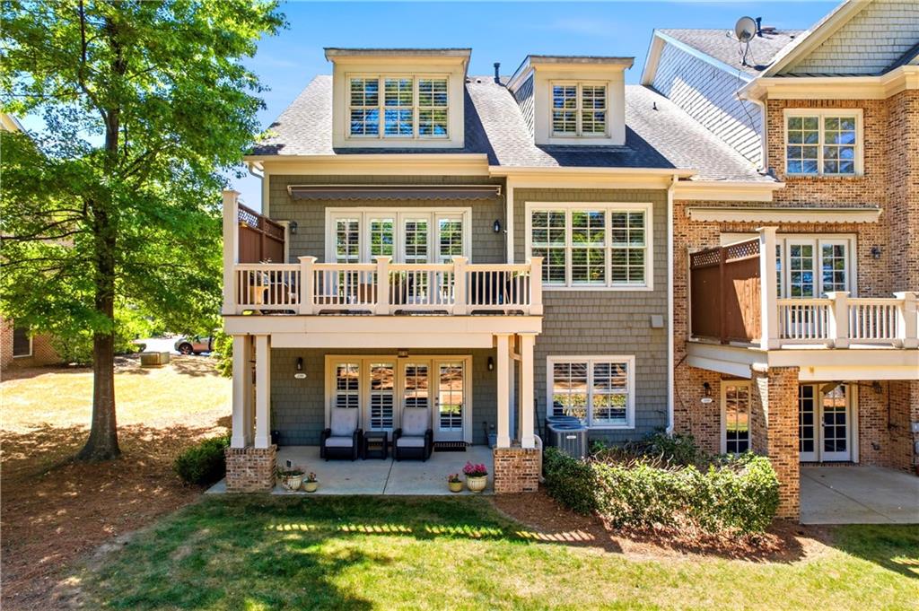 2398 St Davids Square, Unit 16 Kennesaw, GA 30152 - Photo 20 of 48 front view of a building with a yard