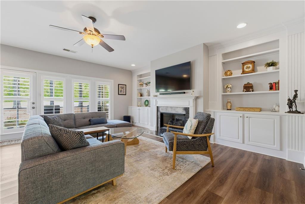 2398 St Davids Square, Unit 16 Kennesaw, GA 30152 - Photo 24 of 48 a living room with furniture fireplace and a flat screen tv