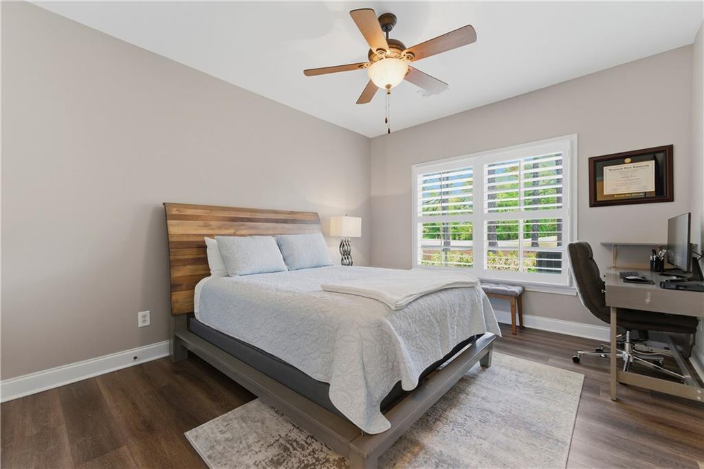 2398 St Davids Square, Unit 16 Kennesaw, GA 30152 - Photo 25 of 48 a bed room with a bed and a table