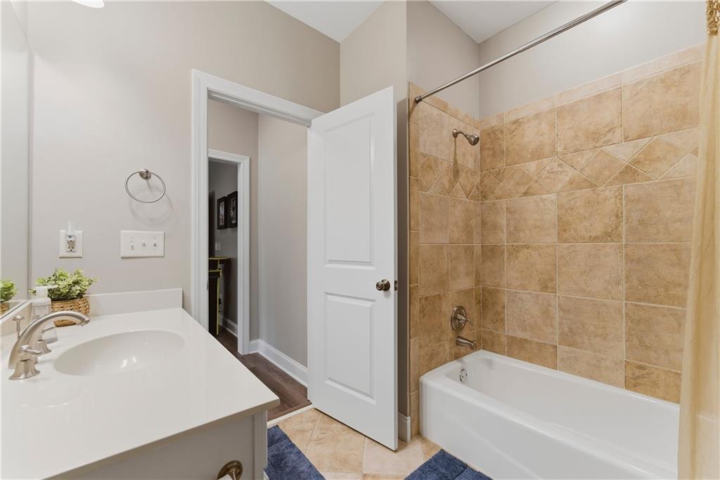 2398 St Davids Square, Unit 16 Kennesaw, GA 30152 - Photo 26 of 48 a bathroom with a sink and a bathtub