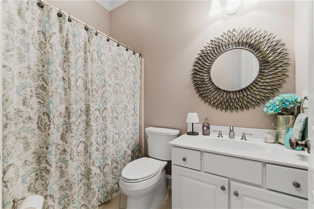 2398 St Davids Square, Unit 16 Kennesaw, GA 30152 - Photo 28 of 48 a bathroom with a toilet sink and mirror