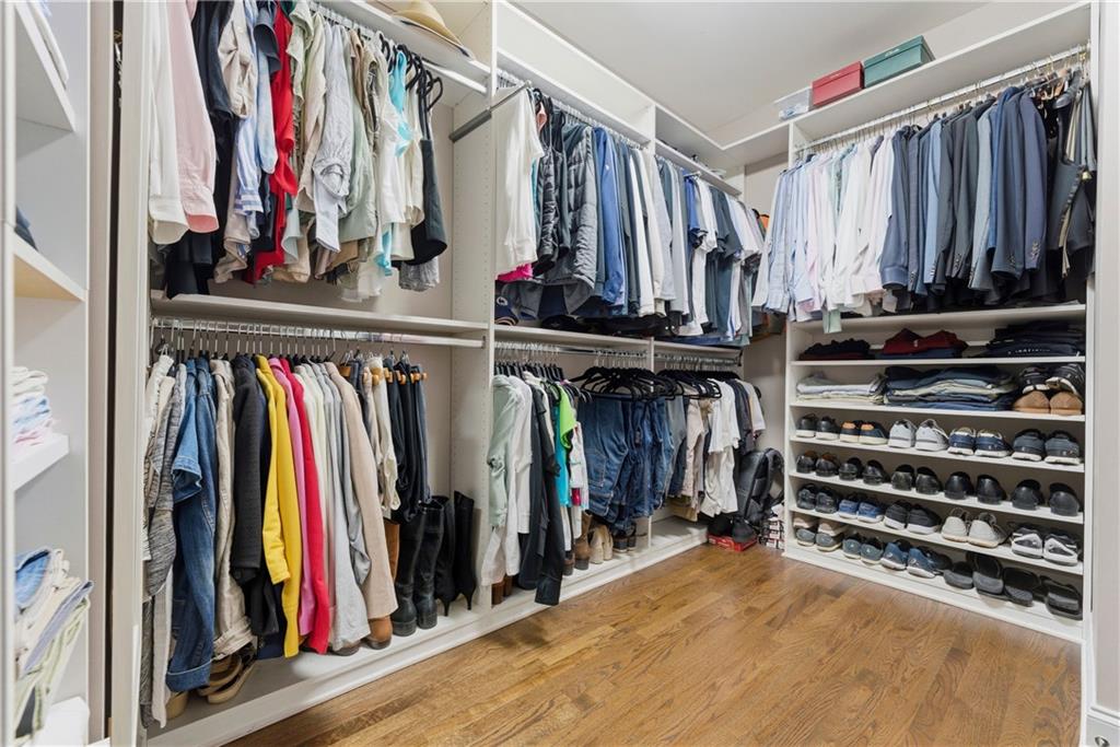 2398 St Davids Square, Unit 16 Kennesaw, GA 30152 - Photo 33 of 48 a view of walk in closet with clothes and shoes