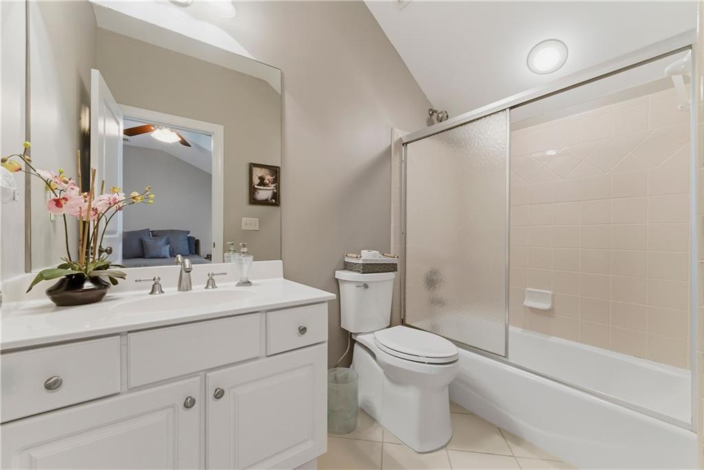 2398 St Davids Square, Unit 16 Kennesaw, GA 30152 - Photo 35 of 48 a bathroom with a sink a toilet and shower
