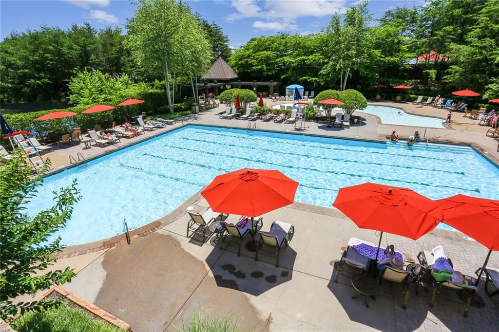 2398 St Davids Square, Unit 16 Kennesaw, GA 30152 - Photo 42 of 48 a view of a swimming pool and lounge chairs