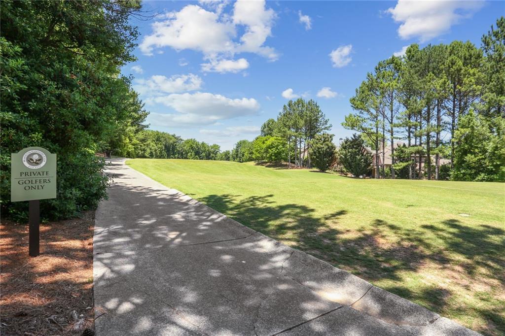 2398 St Davids Square, Unit 16 Kennesaw, GA 30152 - Photo 46 of 48 a view of a street with a yard