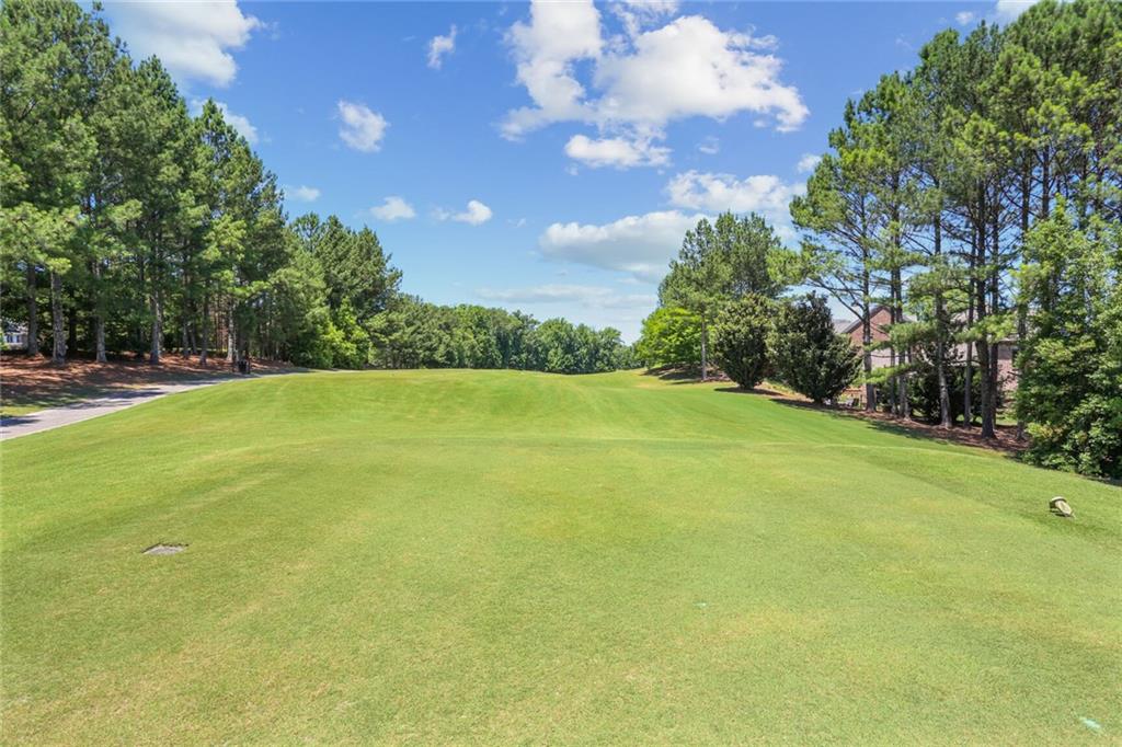 2398 St Davids Square, Unit 16 Kennesaw, GA 30152 - Photo 48 of 48 a view of a field with an trees in front of it