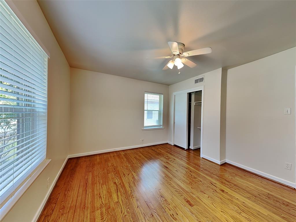 1002 Noble Avenue Carrollton, TX 75006 - Photo 11 of 16 a view of empty room with wooden floor and fan